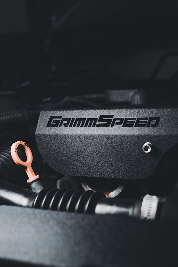 Detailed view of a metallic engine block with Grimspeed branding and visible components.